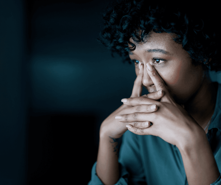 A person sitting quietly, thinking things over before making a decision