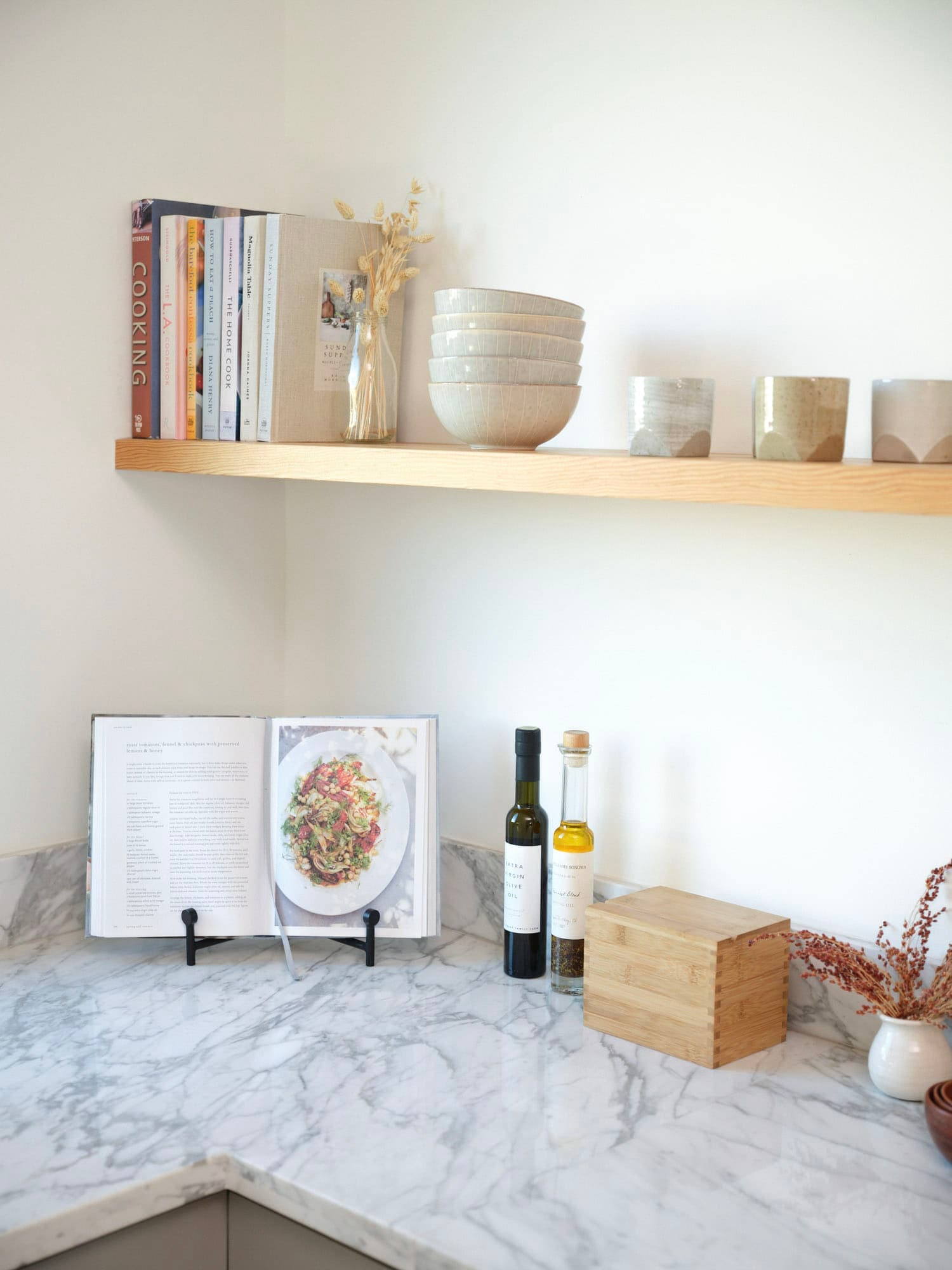 A simple and well-organised shelf at home with only a few carefully placed items on it