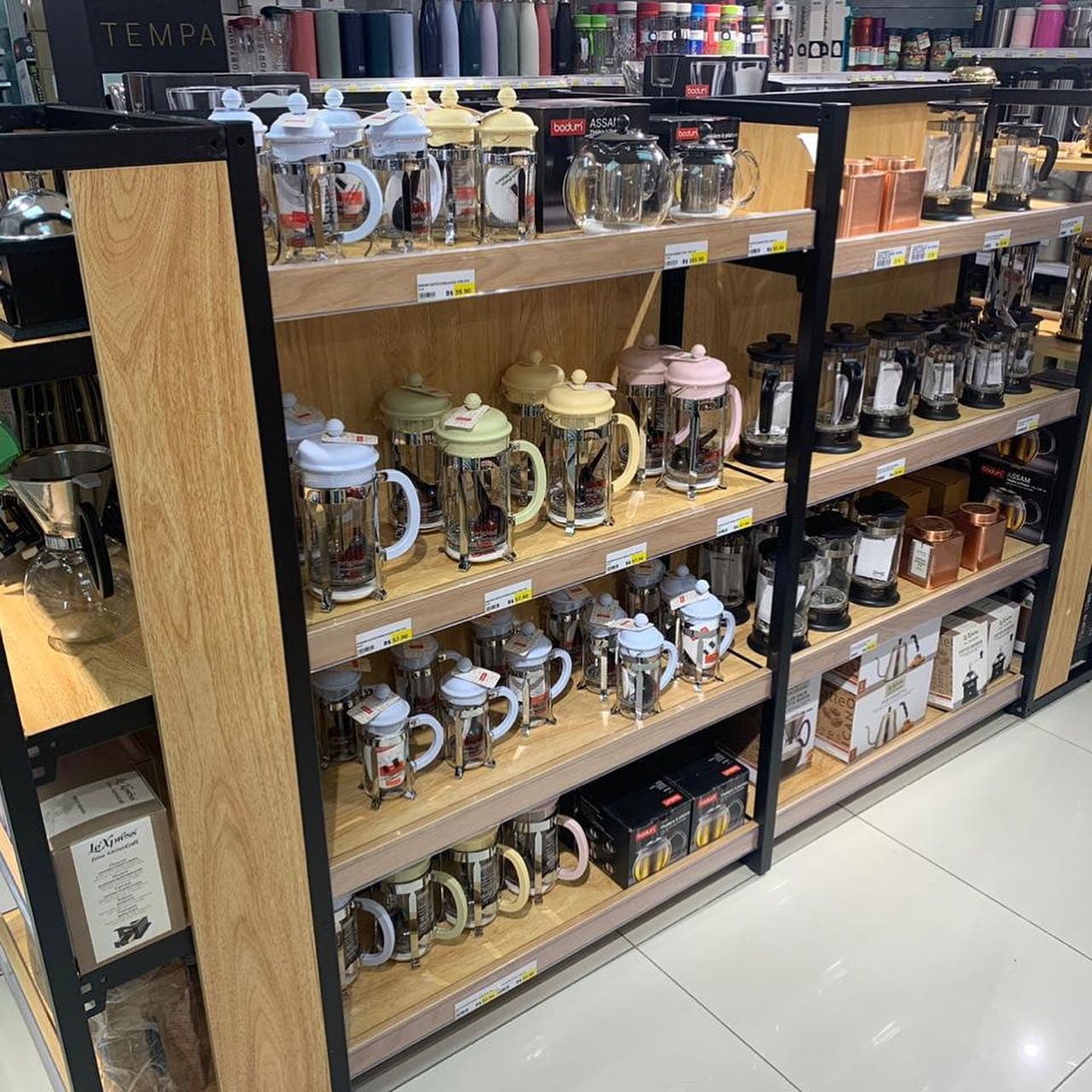 Shelves filled with affordable and colorful kitchenware inside a GRÂND Concept Store branch