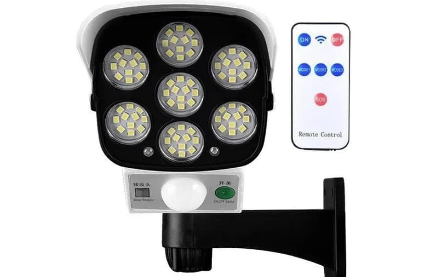 A compact solar motion sensor light with a black casing and a multi-LED panel