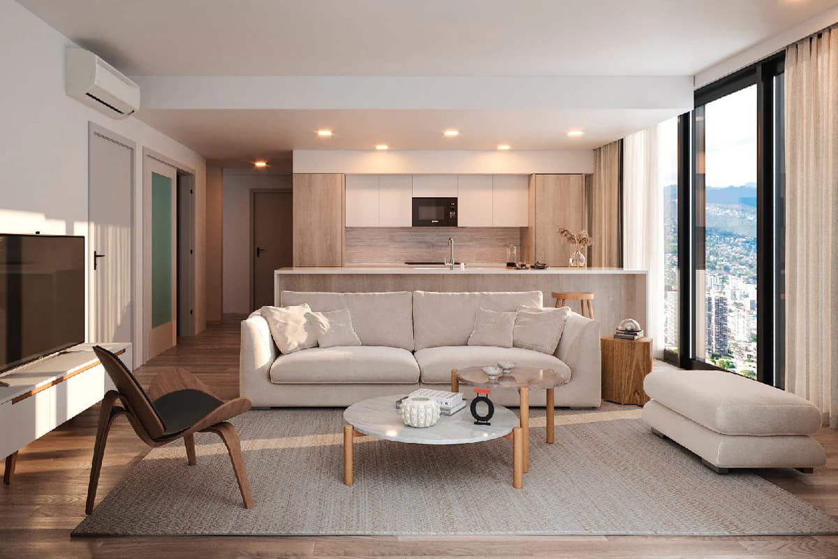 Fully furnished rental living room with sofa, coffee table, and modern appliances